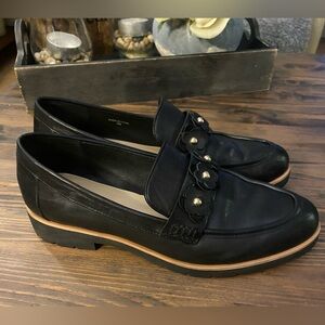 Kate Spade New York Karisa black leather loafers with a floral details.